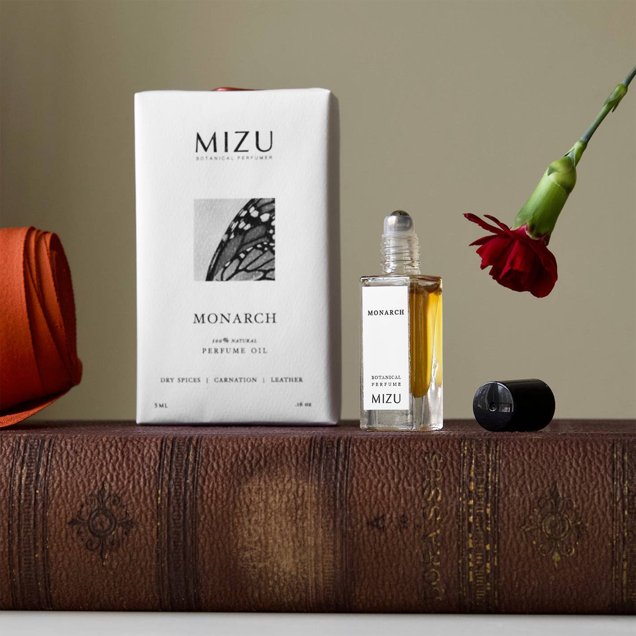 mizu monarch bottle and box on book