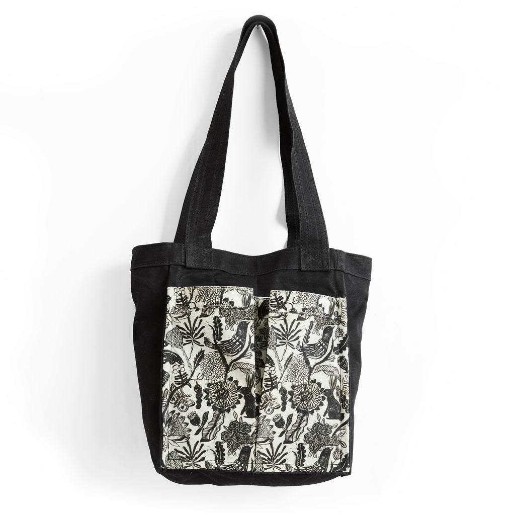 petite lapine + black | treki in black waxed canvas with petite lapine pockets